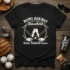 Black t-shirt with "Moms Against Baseball White Baseball Pants" text and graphic of muddy pants, baseball field, and bases