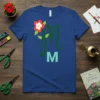 Monogram M M T-Shirt with a green cursive M and a block M, accented by a red and white flower