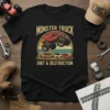 Black t-shirt featuring a vintage-style monster truck jumping over cars with text "MONSTER TRUCK DIRT & DESTRUCTION"
