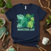 Monstera Leaf T-Shirt with vibrant green tropical leaves and text, perfect for plant lovers