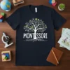 Montessori learn grow bloom quote on a navy t-shirt with a tree graphic and educational icons