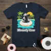 Moodoy Cow T-Shirt design showing a cow wearing sunglasses in a pool float, with palm trees and sun in the