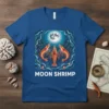 Blue t-shirt with "Moon Shrimp" text and illustration of shrimp under a full moon, surrounded by floral elements