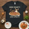 More Spagetti Less Upsetti text with a calico cat lying on a plate of spaghetti graphic on a black t-shirt