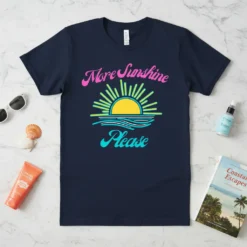 Navy blue t-shirt with "More Sunshine Please" text and a retro sun graphic over waves