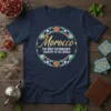 Navy t-shirt with gold text "Morocco the MOST DISTINGUISHED COUNTRY IN THE WORLD" inside a circular mosaic pattern