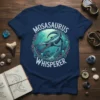 Mosasaurus Whisperer T-Shirt featuring a detailed illustration of a Mosasaurus in an underwater scene with jellyfish and ruins