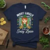 T-shirt with white text "MOST LIKELY to be a Sassy Lassie" and a cartoon leprechaun girl graphic, surrounded by shamrocks