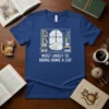 Blue t-shirt with white text "Most LikieLy to Bring Home a Cat" and a graphic of a sleeping cat on