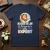 Mother In Law Whisperer Level Expert text with a lion and dove graphic on a navy t-shirt