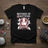 Mother Of Kittens text with a regal cat on a throne surrounded by smaller kittens graphic on a black t-shirt