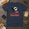 Mothman Stole My Hotdog t-shirt featuring a cartoon Mothman chasing a hotdog under a full moon