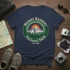 Mount Rainerr National Park retro graphic tee featuring a mountain, sun, and trees with EST. 1989 text