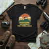 Mountains are not funny THEY ARE HILL AREAS quote on a black t-shirt with a retro mountain graphic and hiker