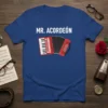 Mr. Acordeón text above a cartoon red accordion graphic on a blue t-shirt, perfect for musicians