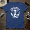 Muscle Shoals Alabama Established 1923 t-shirt design with a waterfall, mountains, and trees in a circular emblem