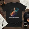 Black t-shirt with "Music Is My Universe" text and a colorful grand piano graphic with musical notes and a treble