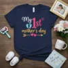 Navy t-shirt with "My 1st Mother's Day" text and baby footprints graphic