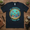 My Aquarium Is Calling And I Must Go t-shirt design featuring cartoon fish and coral in a porthole view