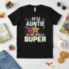 Black t-shirt with white text "My Auntie is like really SUPER" featuring a superhero star graphic
