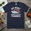 Navy t-shirt with white text "My Boat Doesn't Run On Thanks" and a graphic of a boat being refueled