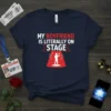 Navy t-shirt with white and red text "MY BOYFRIEND IS LITERALLY ON STAGE" above a graphic of a singer on