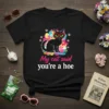 Black t-shirt with "My cat said you're a hoe" text and a black cat wearing heart sunglasses, surrounded by colorful
