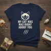 Navy blue t-shirt with white text "MY CAT WAS WAS RIGHT ABOUT YOU" and a cartoon cat face with claw