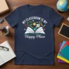 My Classroom Is My Happy Place quote on a navy t-shirt with classroom graphics like books, a chalkboard, and a