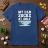 My Dad Sucks At Golf humorous quote on a navy blue t-shirt with a cartoon graphic of a golfer missing
