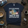 T-shirt design with text "MY DAY STARTS BACKWARDS I WAKE UP TIRED AND GO TO BED WIDE AWAKE" and a