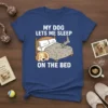 My Dog Lets Me Sleep On The Bed t-shirt design featuring a sleeping dog on a bed with paw print