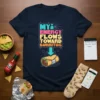 Navy t-shirt with colorful text "MY ENERGY FLOWS TOWARD BURRITOS" pointing down to a graphic of a burrito