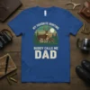 My Favorite Hunting Buddy Calls Me Dad T-Shirt featuring deer graphic and sunset forest scene