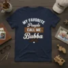 My Favorite People Call Me Bubba t-shirt design with white text and a brown wood sign graphic
