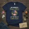 My Favorite Soldier Calls Me Uncle text design with camouflage font and military vehicle graphic on a navy t-shirt