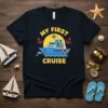 My First Cruise text with a cartoon cruise ship, sun, anchors, and dolphin graphic on a navy t-shirt