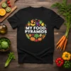 My Food Pyramids text design with colorful fruits and vegetables arranged in a circle on a black t-shirt