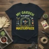 T-shirt featuring the text "MY GARDEN IS MY MOST beautiful MASTERPIECE" with floral arch and gardening tools graphic