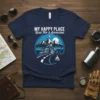 My Happy Place Road Trip & Adventure text with a motorcycle, mountains, and campfire graphic on a navy t-shirt