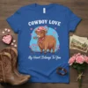 Highland cow wearing a pink cowboy hat and holding a rose, with "Cowboy Love My Heart Belongs To You" text