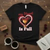 Black t-shirt with a heart graphic and wine glass, saying "my Heart Is Full"