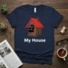 Black cat wearing a witch hat inside a wooden house with the text "My House" below, on a navy blue
