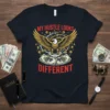 My Hustle Looks Different T-Shirt with eagle and money graphic, bold red text, and gold accents