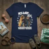 Navy blue t-shirt with cartoon illustration of three Mastiffs on a lap, text "My Lap Dog Weighs 100lbs"
