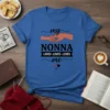 Blue t-shirt with "my NONNA LOVES LOVES LOVES me" text and heart graphics, showing hands holding