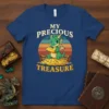 My Precious Treasure t-shirt design with a cute green dragon sitting on a pile of gold coins and treasure chests