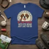 My Saint Bernard Hits Its Head Just Like You Do quote on a blue t-shirt with a Saint Bernard dog