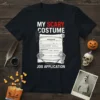 Black t-shirt with "My Scary Costume Job Application" text and a spooky job application design