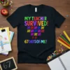 Black t-shirt with colorful text "MY TEACHER SURVIVED! 67 DAYS OF ME!" and tally marks representing 67 days